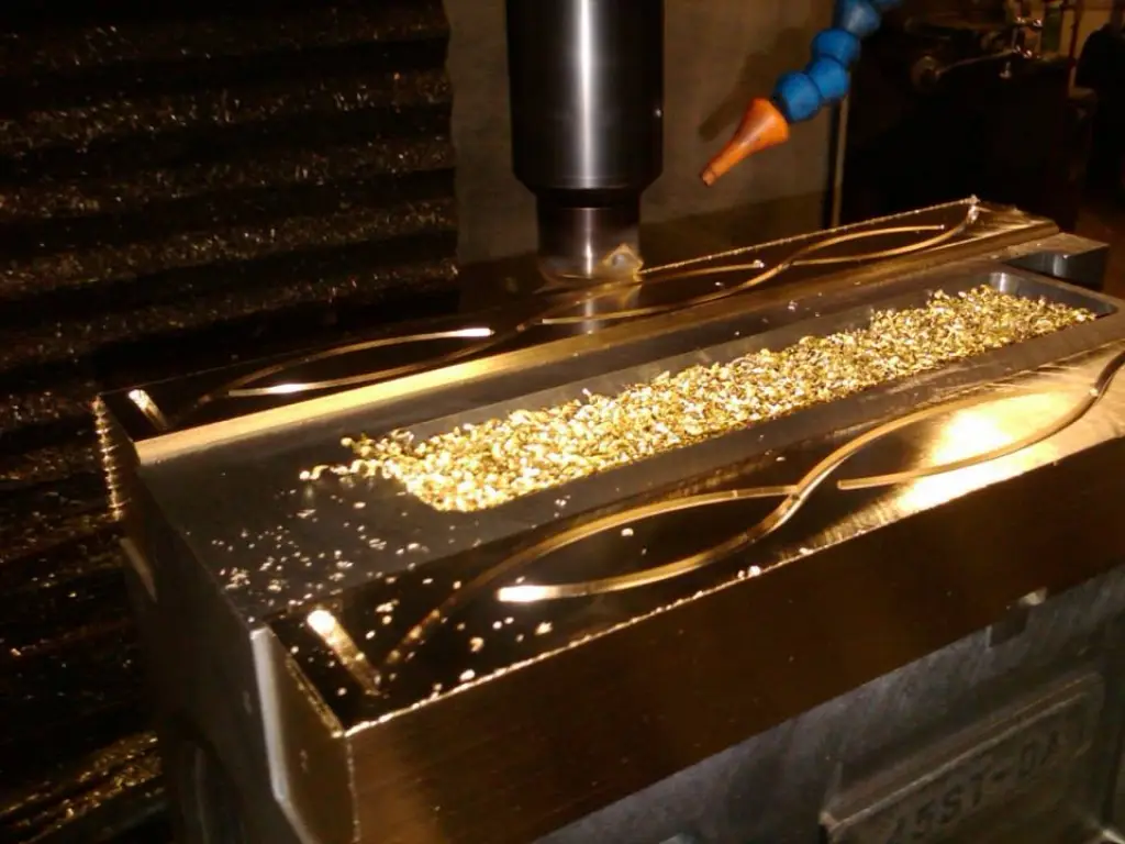 CNC milling a mold cavity with chips in the pocket