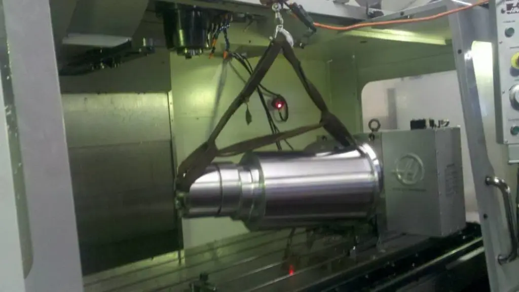 Large shaft held in a CNC machining center